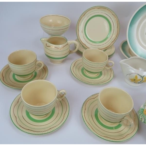 76 - A quantity of Susie Cooper and Clarice Cliff ceramics including a relief moulded dish, cups, saucers... 