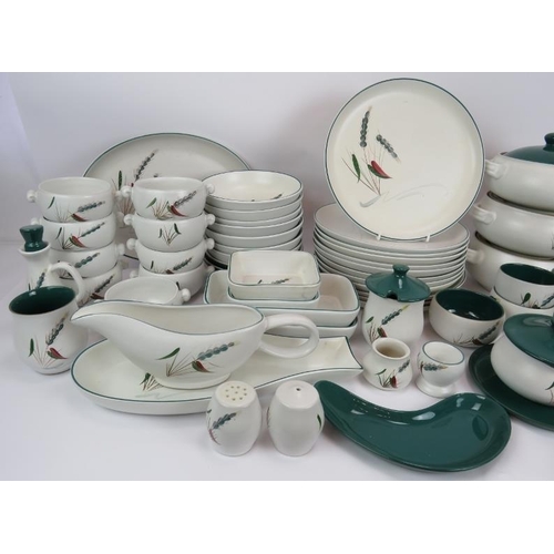 77 - A large quantity of Denby Green Wheat ovenproof kitchen ware including plates, tureens, bowls, dishe... 