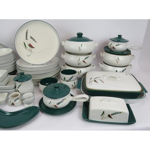 77 - A large quantity of Denby Green Wheat ovenproof kitchen ware including plates, tureens, bowls, dishe... 