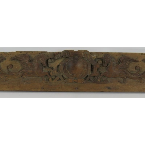 8 - A decorative 18th/19th century carved walnut frieze depicting a pair of unicorns around a central ca... 