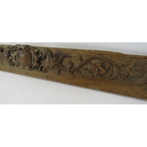 8 - A decorative 18th/19th century carved walnut frieze depicting a pair of unicorns around a central ca... 