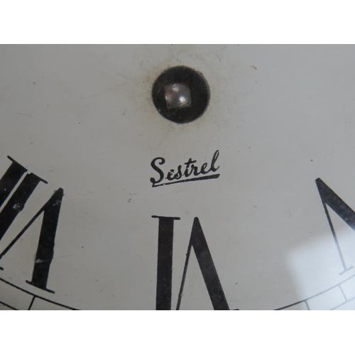 82 - A Sestrel brass ships clock with painted dial and bevelled glass case. Diameter 19cm. Key present.
C... 