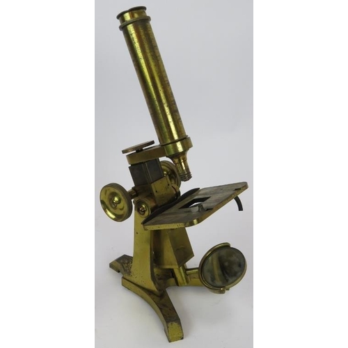 84 - A mid 19th century brass microscope by Moritz Pillischer London No 584, with spare lenses and mahoga... 