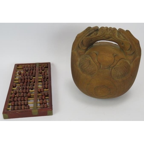 86 - A carved bamboo Chinese brush pot, a carved wood Chinese 'bell' and a wooden abacus. Brush pot 25cm.... 