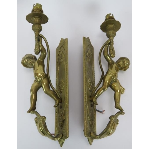 87 - A pair of brass Rococo style cherub wall light sconces. Height 35cm.
Condition report: Untested.