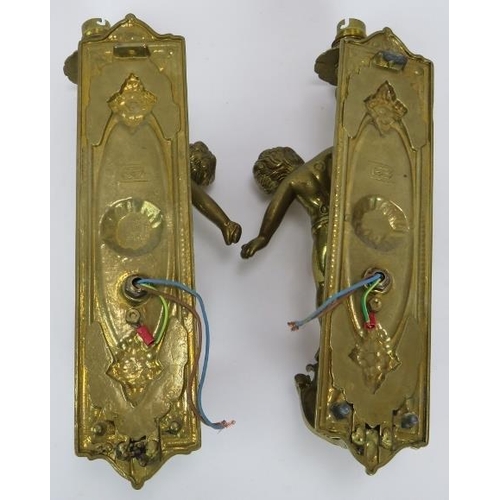 87 - A pair of brass Rococo style cherub wall light sconces. Height 35cm.
Condition report: Untested.