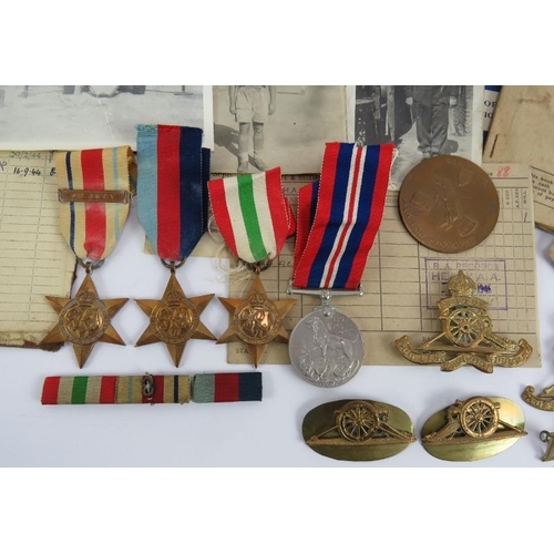 98 - A WW2 Royal Artillery medal group and associated badges and ephemera relating to Gunner W T Adams 17... 