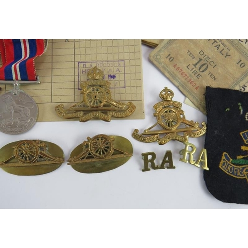 98 - A WW2 Royal Artillery medal group and associated badges and ephemera relating to Gunner W T Adams 17... 