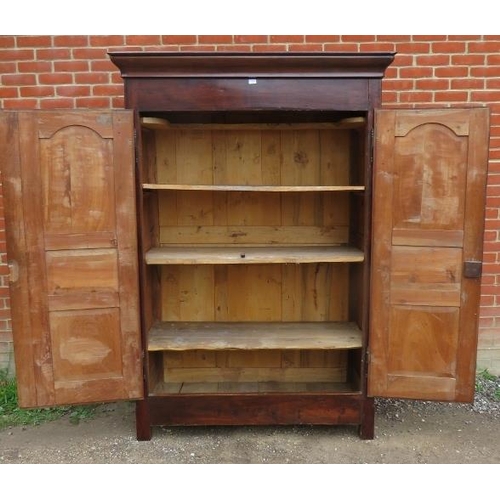 703 - An 18th century French cherrywood armoire of excellent colour with fielded panels to doors, brass lo... 