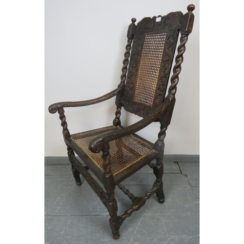 704 - A 17th century Carolean oak hall chair with bergere back and seat panels, featuring barley twist upr... 