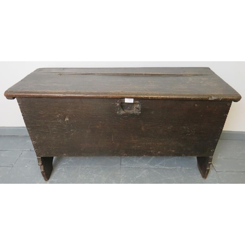 708 - A 17th century six plank oak coffer, on stile supports.
Condition report: Split to lid, various mark... 