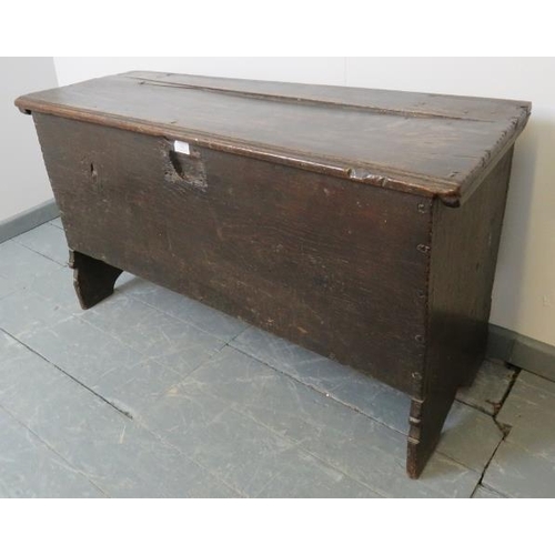 708 - A 17th century six plank oak coffer, on stile supports.
Condition report: Split to lid, various mark... 