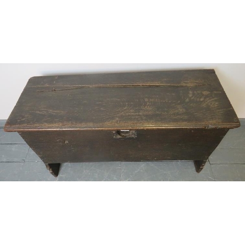 708 - A 17th century six plank oak coffer, on stile supports.
Condition report: Split to lid, various mark... 