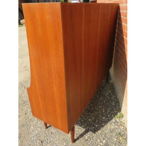 710 - A mid-century teak highboard by G Plan, featuring a fall front drinks cabinet, two cupboards and two... 