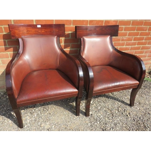 712 - A pair of contemporary richly coloured fruitwood armchairs in the French Empire taste, upholstered i... 