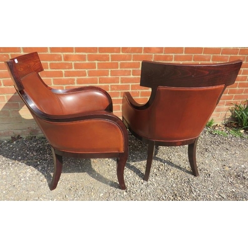 712 - A pair of contemporary richly coloured fruitwood armchairs in the French Empire taste, upholstered i... 