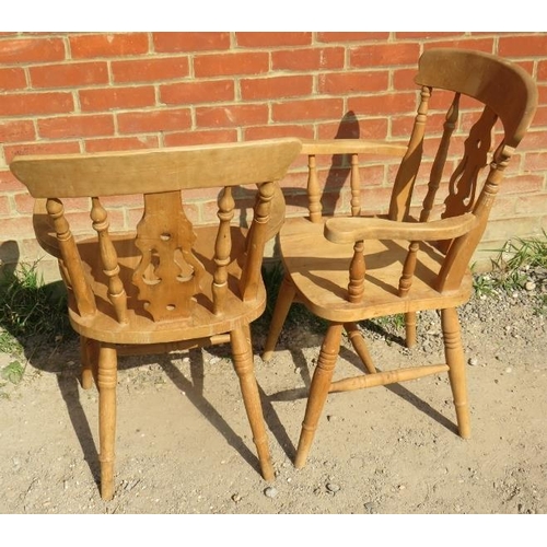 715 - A pair of 19th century style light fruitwood Windsor open sided armchairs, on turned supports with a... 