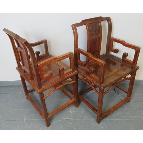 719 - A pair of Chinese Juzhou style jumu wood (southern elm) open sided armchairs with carved back panels... 