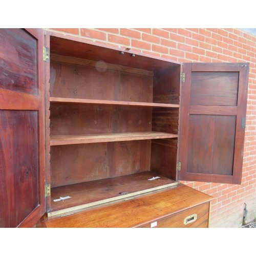 722 - A 19th century camphorwood campaign secretaire bookcase with brass mounts, the bookcase with two hei... 