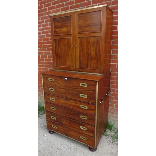 722 - A 19th century camphorwood campaign secretaire bookcase with brass mounts, the bookcase with two hei... 