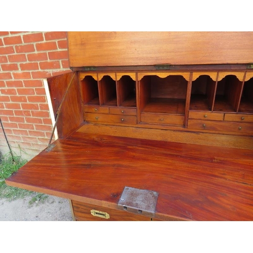 722 - A 19th century camphorwood campaign secretaire bookcase with brass mounts, the bookcase with two hei... 