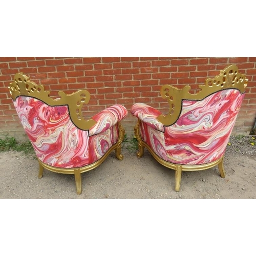 729 - A pair of very ornate giltwood armchairs, the frames carved and pierced in the Rococo style, upholst... 