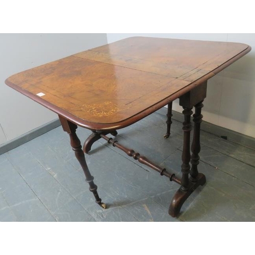 731 - A Victorian walnut Sutherland table, with marquetry inlay, on turned supports with ceramic castors. ... 