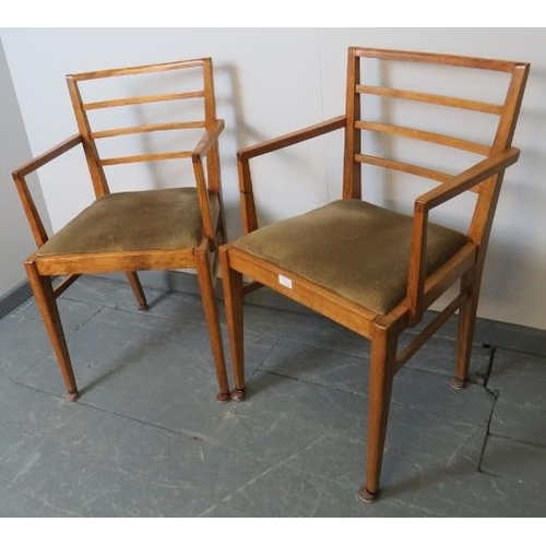 732 - A pair of Art Deco light oak open sided elbow chairs, with drop-in seat pads, on tapering square sup... 