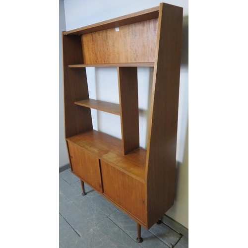 735 - A mid-century teak wall unit with display shelving over a base cupboard, on turned tapering supports... 