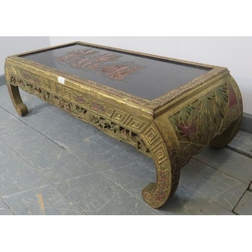 737 - A vintage Chinese import opium table, the top with relief carving depicting sailing junks, the carve... 