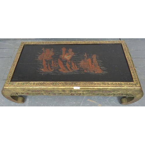 737 - A vintage Chinese import opium table, the top with relief carving depicting sailing junks, the carve... 