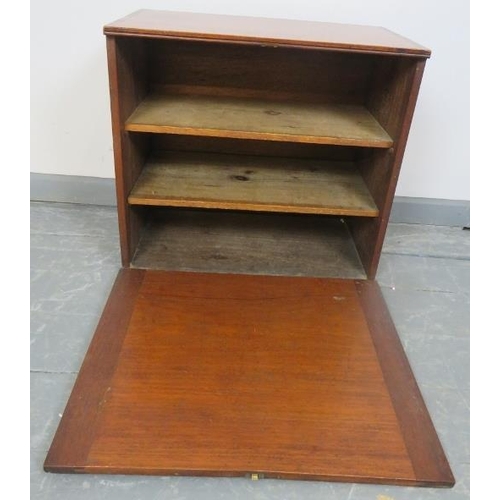 738 - An early 20th century medium oak bank of enclosed shelves, the fall front secured with a brass catch... 