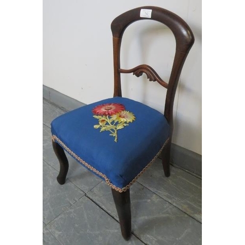 742 - A vintage mahogany balloon-back child’s chair in a Victorian taste, upholstered in a blue material e... 