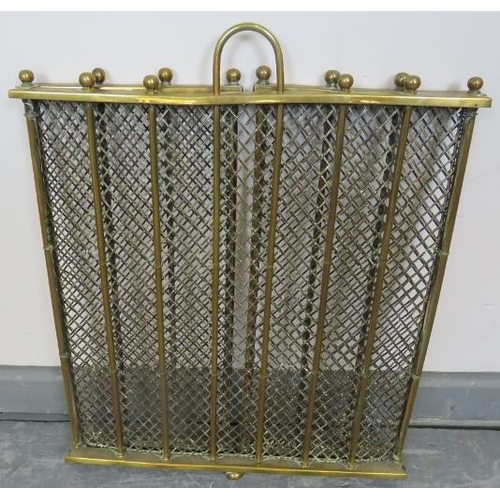 744 - An Edwardian three section folding brass and wire mesh fireguard with ball finials. 
Condition repor... 