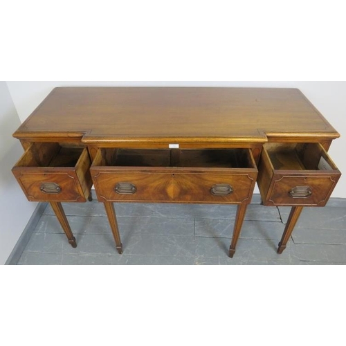 746 - An Edwardian Regency revival mahogany breakfront sideboard strung with ebony, housing three drawers ... 