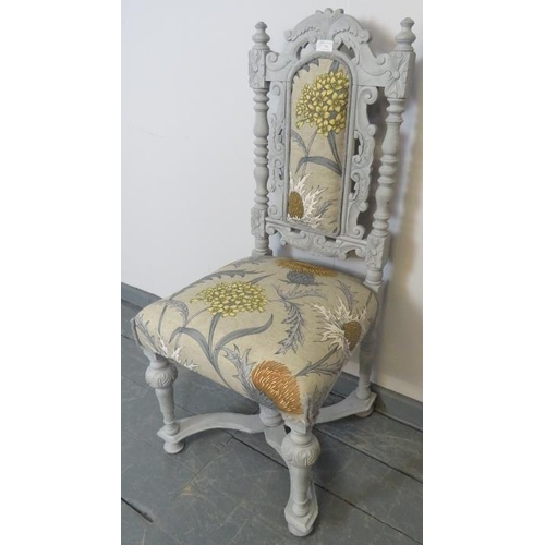 748 - An occasional hall chair, carved in the Carolean style with Flemish scrolls and acanthus leaves and ... 