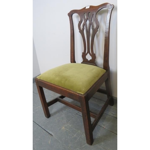 751 - A Georgian oak occasional chair with pierced backsplat and drop in seat pad upholstered in pale gree... 