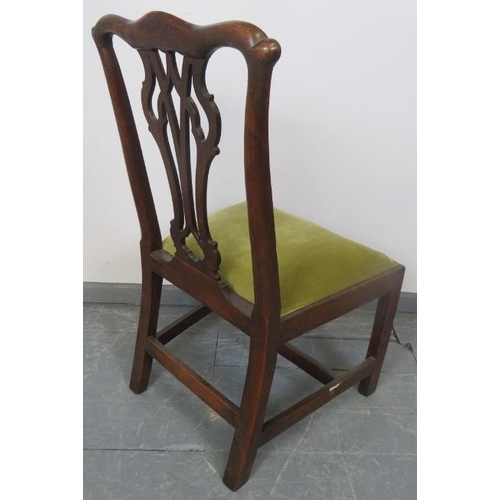 751 - A Georgian oak occasional chair with pierced backsplat and drop in seat pad upholstered in pale gree... 