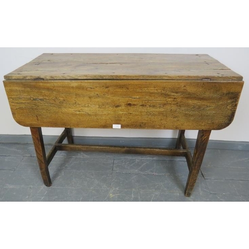 753 - A Georgian elm country made Pembroke table of great character, on tapering square supports with an ‘... 