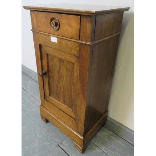 755 - A 19th century Continental fruitwood bedside cabinet with single drawer, over a cupboard with fitted... 