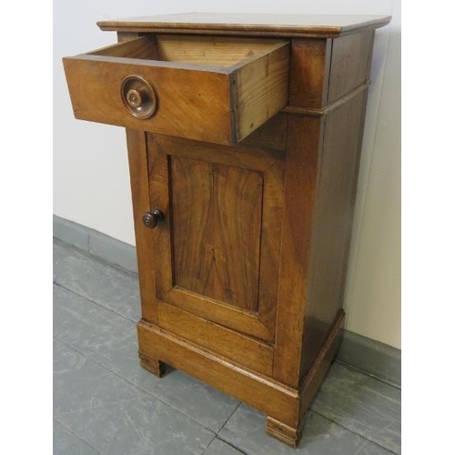 755 - A 19th century Continental fruitwood bedside cabinet with single drawer, over a cupboard with fitted... 