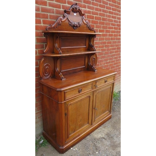 757 - A Victorian walnut chiffonier sideboard with carved and shelved back, housing two short drawers over... 