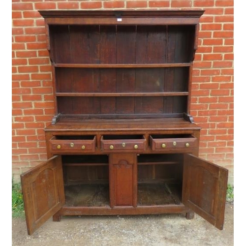 758 - A Georgian oak high back dresser, with plate rack shelving over base containing two short drawers an... 