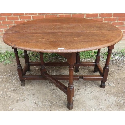 759 - A 19th century oak oval gateleg table with single drawer, on turned and block supports with stretche... 