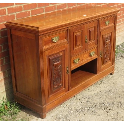 762 - A late Victorian walnut sideboard of three drawers and three cupboards, flanked by reeded columns an... 