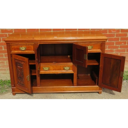 762 - A late Victorian walnut sideboard of three drawers and three cupboards, flanked by reeded columns an... 