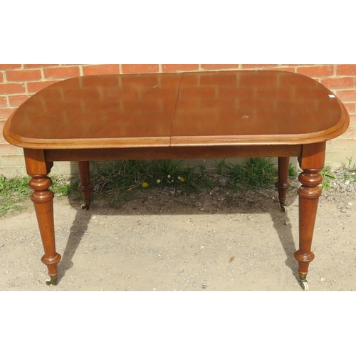 763 - A Victorian mahogany pull-out extending dining table, with additional leaf, on tapering supports wit... 