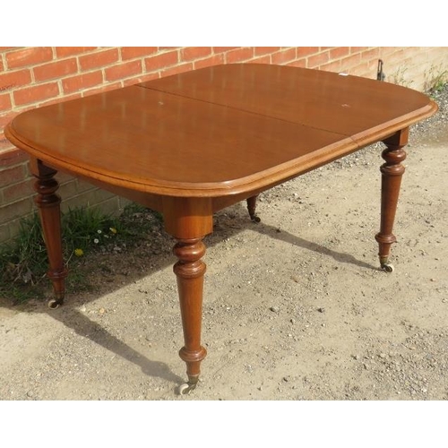 763 - A Victorian mahogany pull-out extending dining table, with additional leaf, on tapering supports wit... 