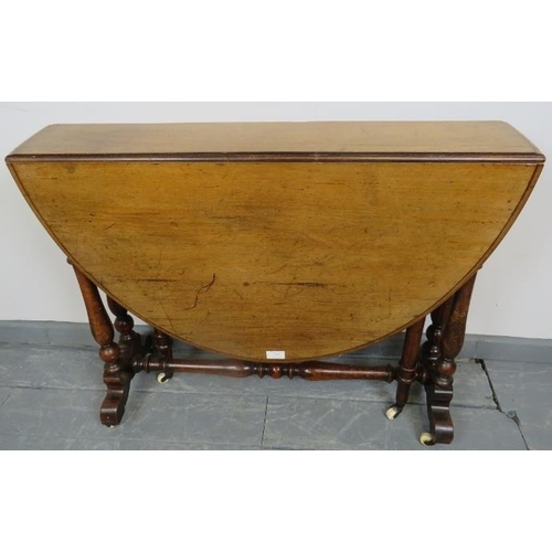 769 - A large Victorian mahogany oval Sutherland table, on baluster turned supports, terminating on cerami... 