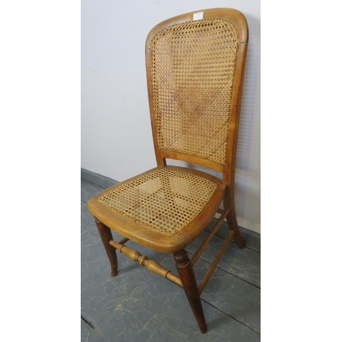 777 - A late 19th/early 20th century fruitwood side chair with bergere seat and back panels, on splayed su... 